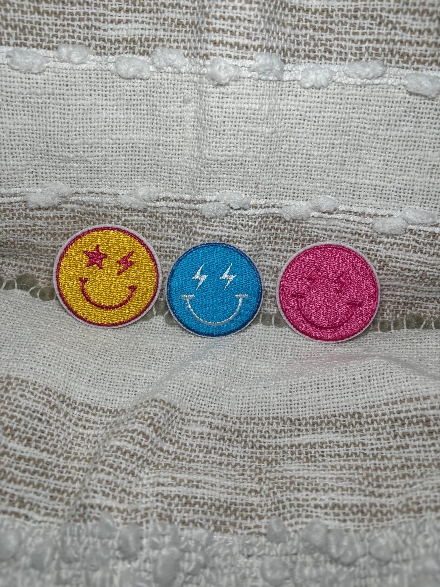 Smiley face w/ lightning bolt patches